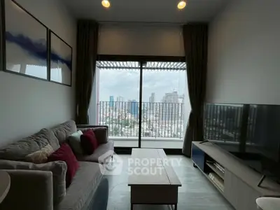 Modern living room with city view, cozy sofa, and large TV, perfect for urban living.