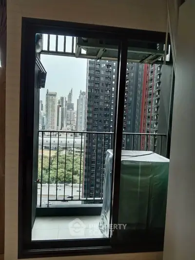 Modern apartment balcony with city skyline view, perfect for urban living.