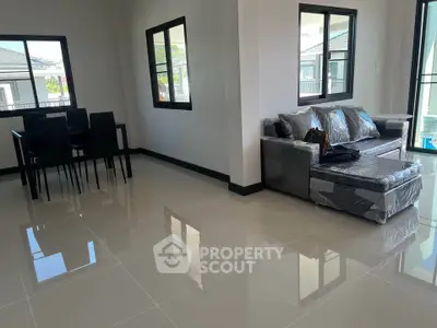 Spacious modern living room with sleek furniture and large windows