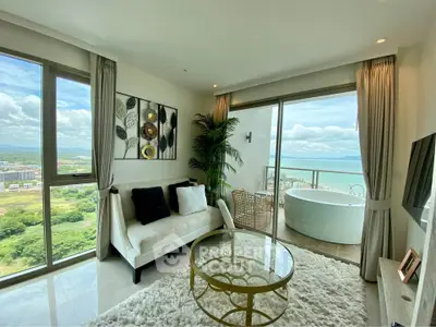 Luxurious living room with stunning ocean view and balcony access