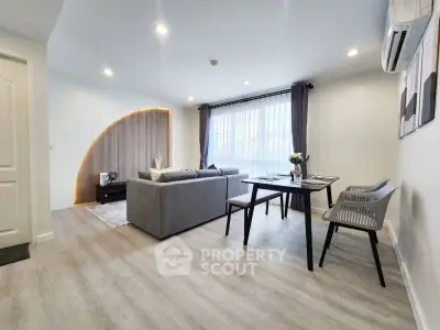 Modern living room with stylish decor and ample natural light