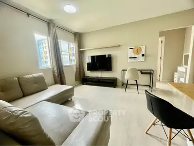 Spacious modern living room with sleek furniture and natural light