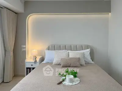 Elegant bedroom with modern lighting and cozy decor