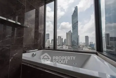 Luxurious bathroom with city skyline view and modern bathtub.