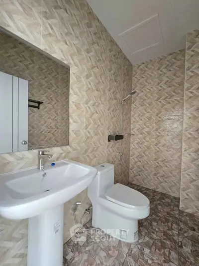 Modern bathroom with stylish tile design and sleek fixtures