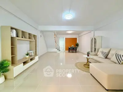 Spacious modern living room with elegant decor and open layout, perfect for family gatherings.