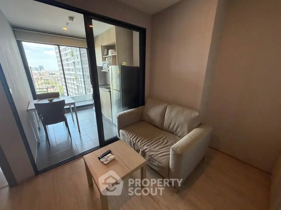 Modern living room with balcony view in high-rise apartment