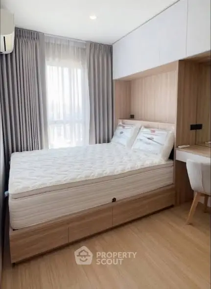 Modern bedroom with stylish wood paneling and natural light