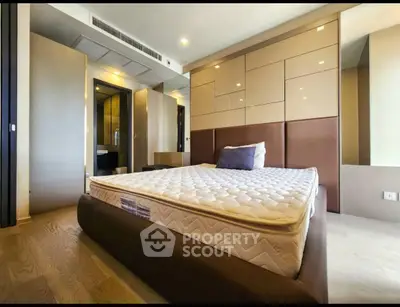 Modern bedroom with stylish design and comfortable mattress in luxury apartment.