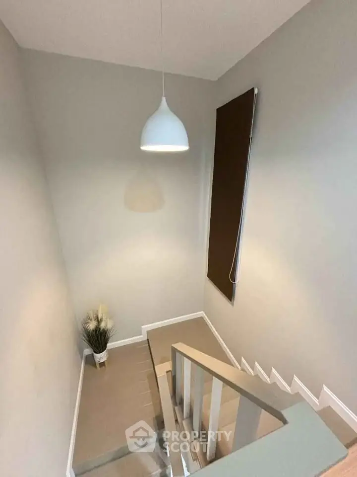 Modern staircase with minimalist design and elegant lighting in a contemporary home.