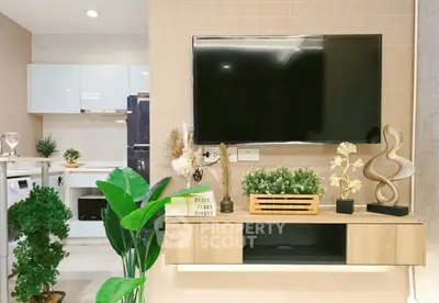 Modern living room with stylish decor and wall-mounted TV, featuring elegant plants and contemporary furniture.
