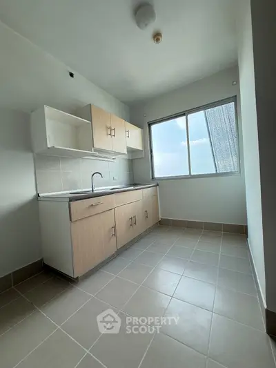 Modern kitchen with ample natural light and sleek cabinetry