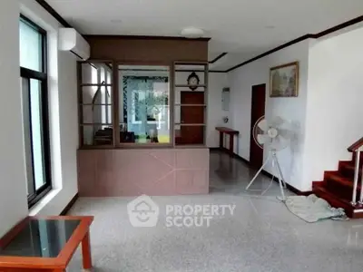 Spacious living area with modern design and large windows