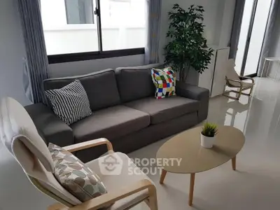 Modern living room with stylish furniture and natural light