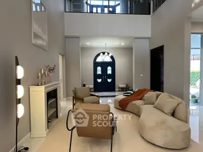 Luxurious modern living room with elegant furniture and high ceilings