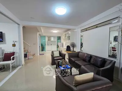 Spacious modern living room with elegant leather sofas and open layout