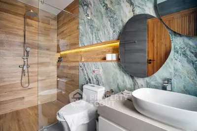 Luxurious modern bathroom with elegant wood and marble accents, featuring a sleek shower and stylish fixtures.