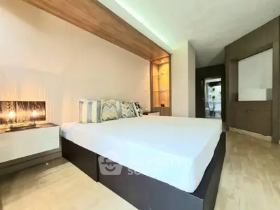Spacious modern bedroom with stylish decor and ambient lighting