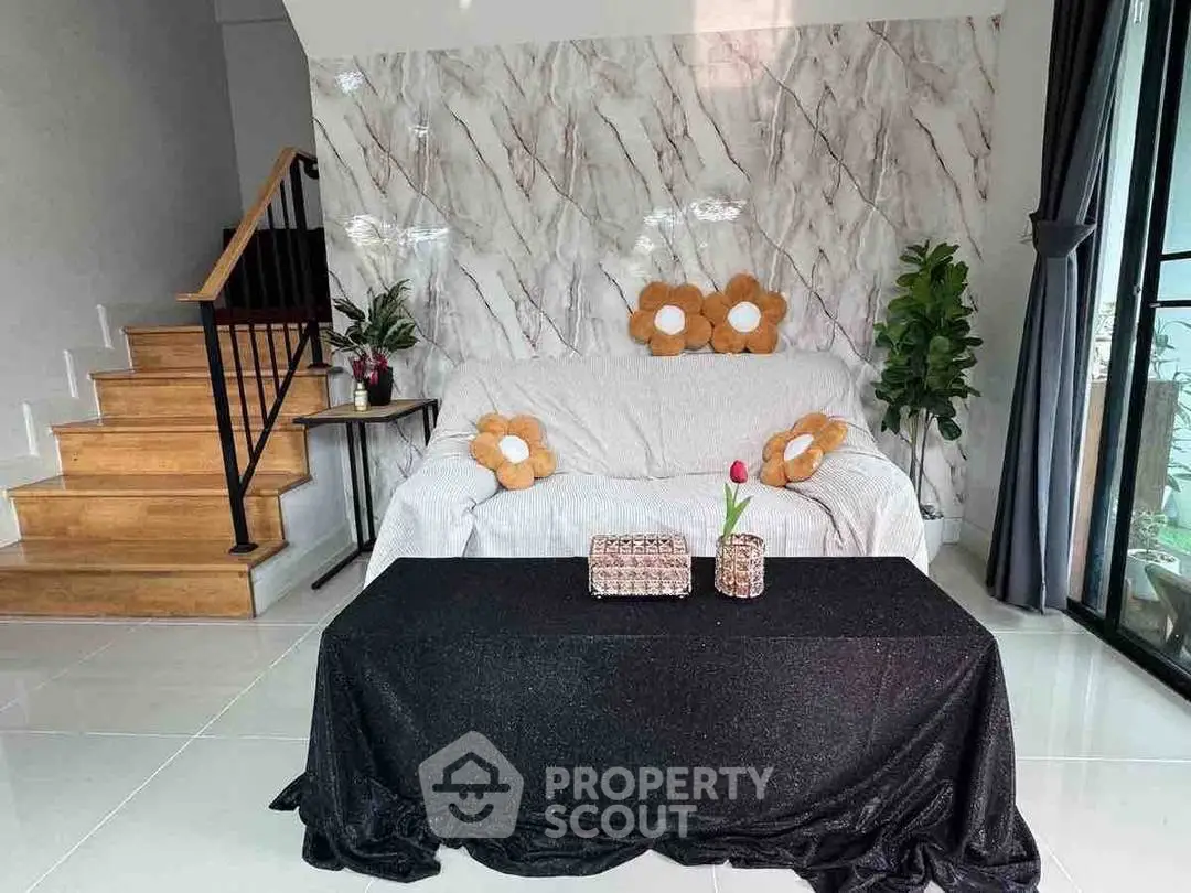 Stylish living room with modern decor and cozy seating area.