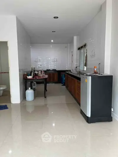 Spacious kitchen with modern appliances and sleek cabinetry in a contemporary home.