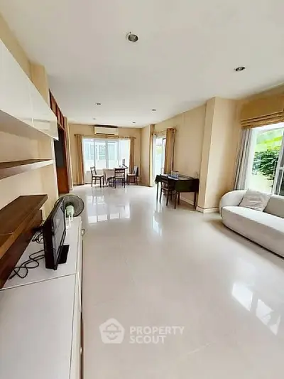 Spacious living room with modern furniture and natural light