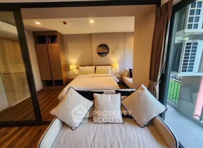 Luxurious bedroom with elegant decor and balcony view in modern apartment