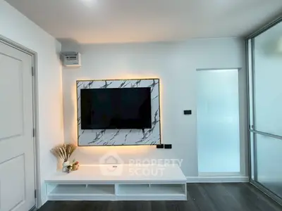 Modern living room with sleek TV setup and stylish decor