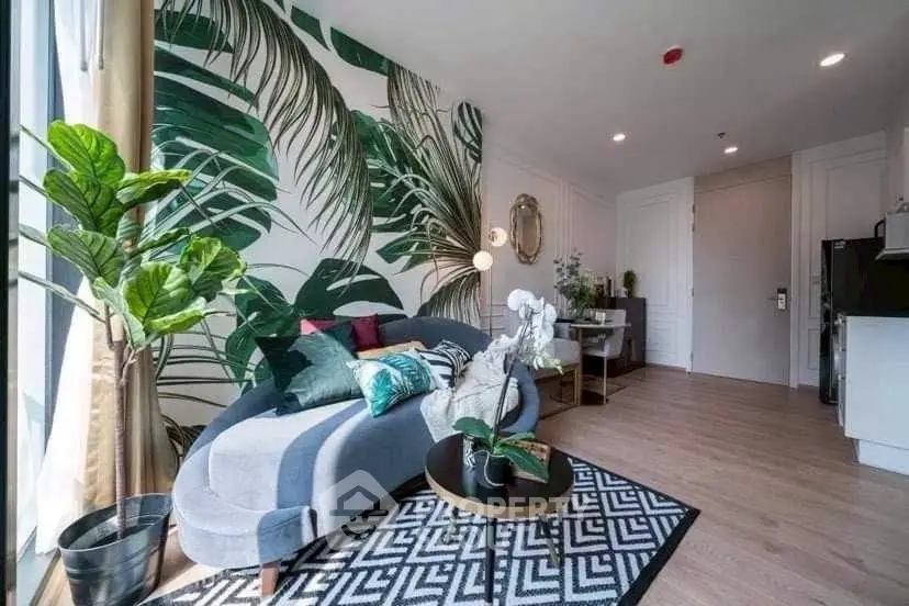 Stylish living room with tropical decor and modern furniture, perfect for relaxation.