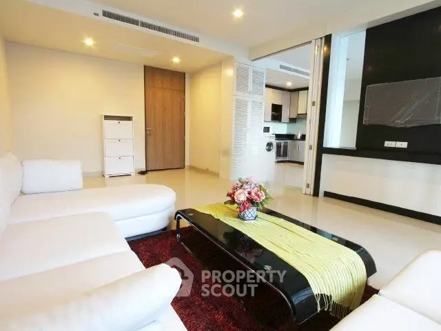 Spacious modern living room with open kitchen and elegant decor