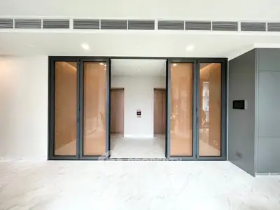 Luxurious modern interior with marble flooring and sleek sliding doors, perfect for upscale living.