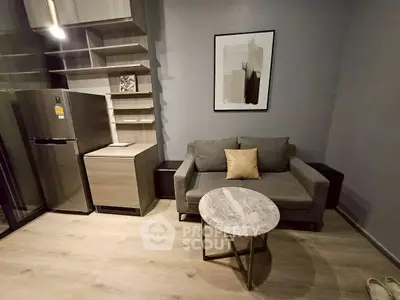 Modern living room with stylish furniture and sleek kitchen appliances