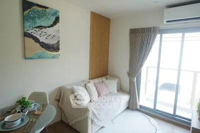 Cozy living room with modern decor and balcony access