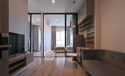 Modern living room with sleek design and open layout, featuring cozy seating and stylish decor.