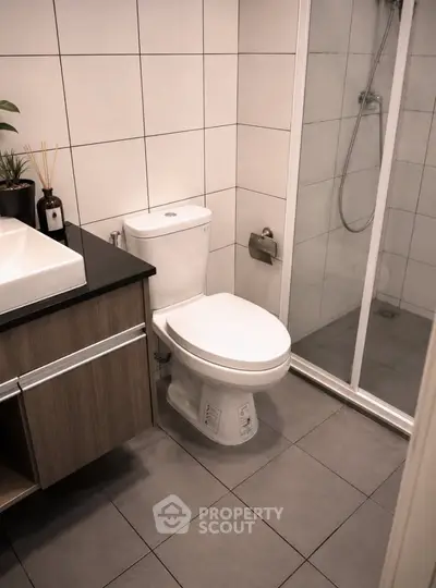 Modern bathroom with sleek fixtures and glass shower enclosure
