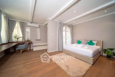 Spacious and elegant bedroom with modern decor and natural light