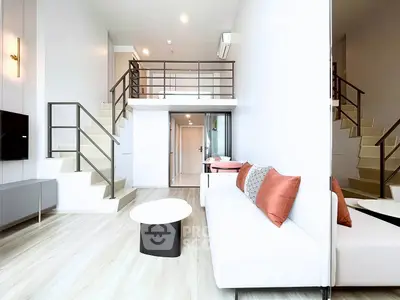Modern duplex living room with stylish decor and mezzanine level