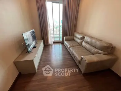 Modern living room with leather sofa and balcony view