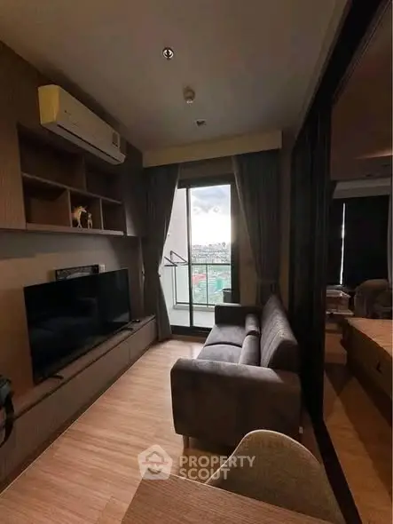 Modern living room with sleek furniture and balcony view in urban apartment