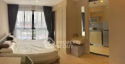 Modern bedroom with large windows and stylish decor in a contemporary apartment
