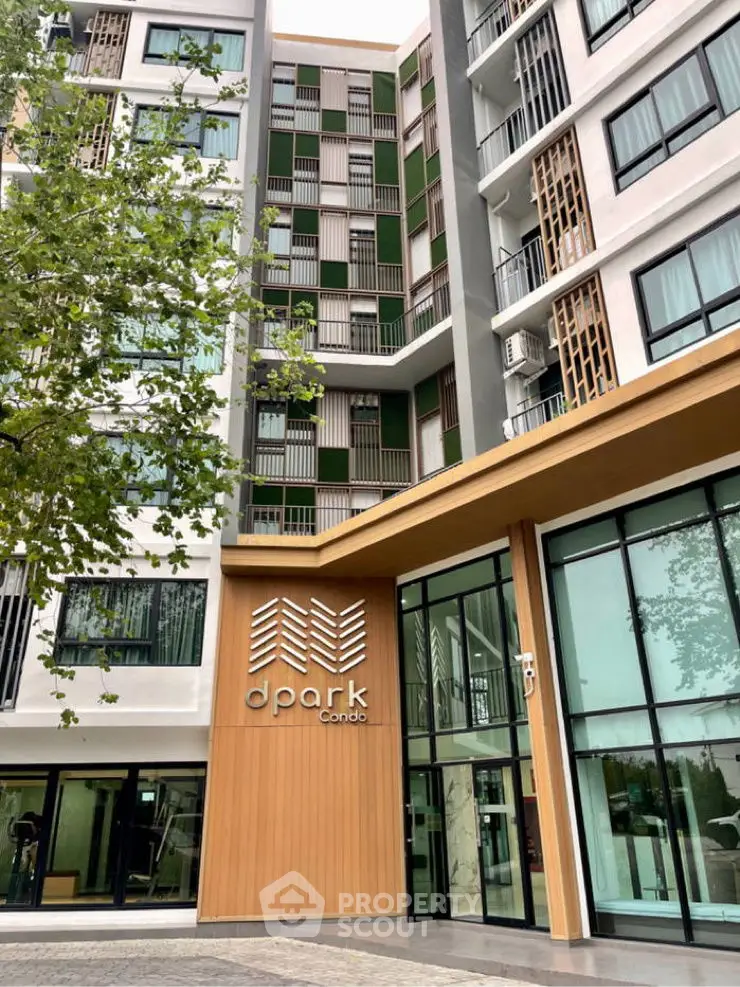Modern condominium exterior with stylish facade and lush greenery.
