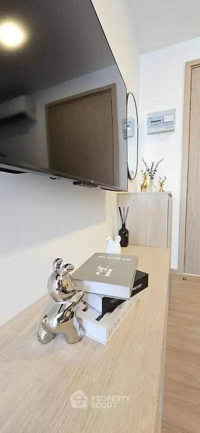 Modern living room with stylish decor and wall-mounted TV