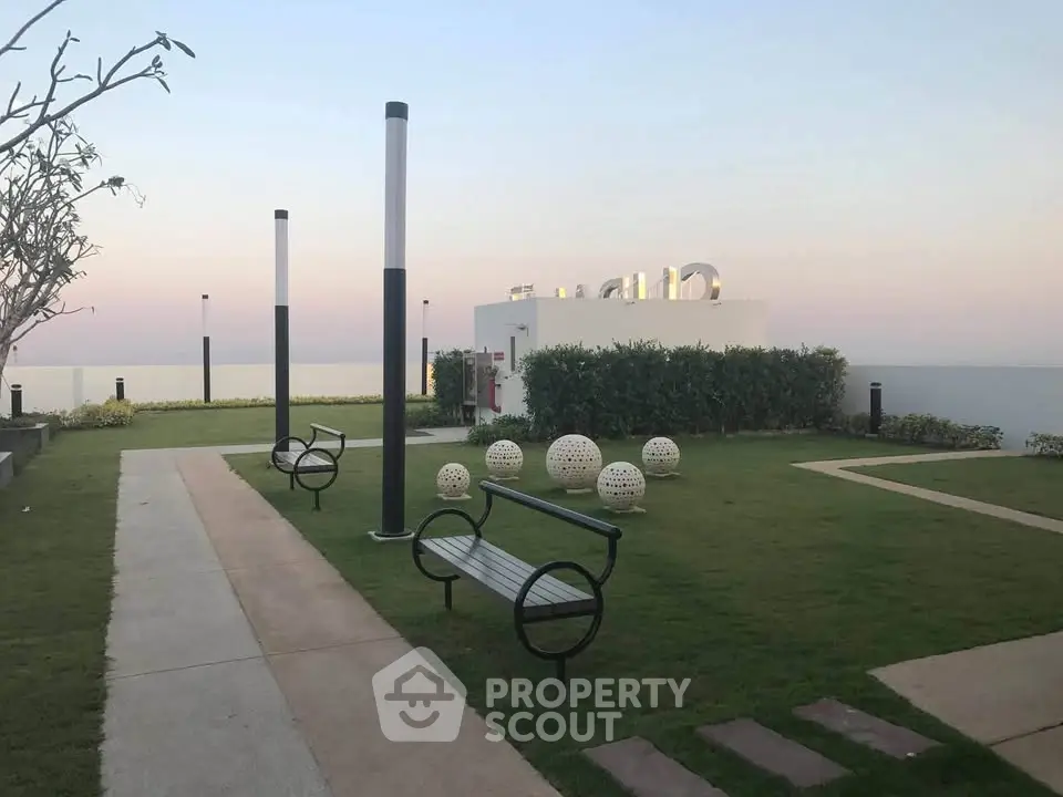 Stunning rooftop garden with modern benches and panoramic views, perfect for relaxation and leisure.