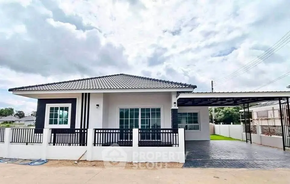 Charming single-story house with modern design and spacious driveway, perfect for family living.