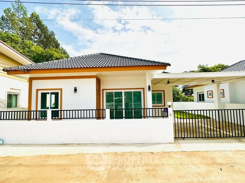 Charming modern house with sleek design and spacious driveway in a serene neighborhood.