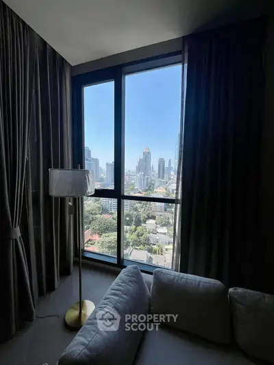 Luxurious living room with stunning city view through large windows.