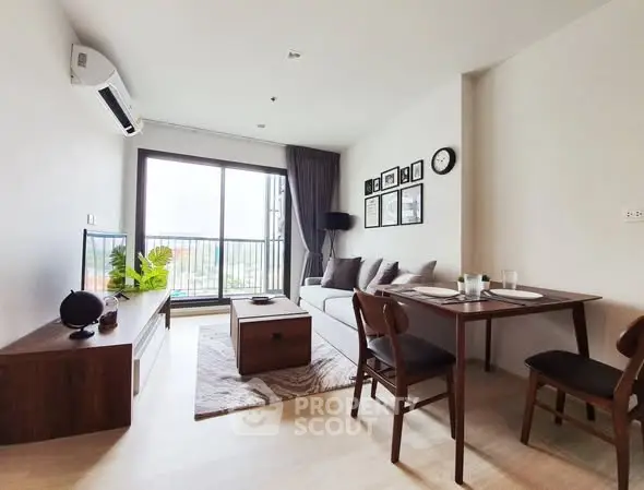 Modern living room with stylish furniture and large window offering natural light