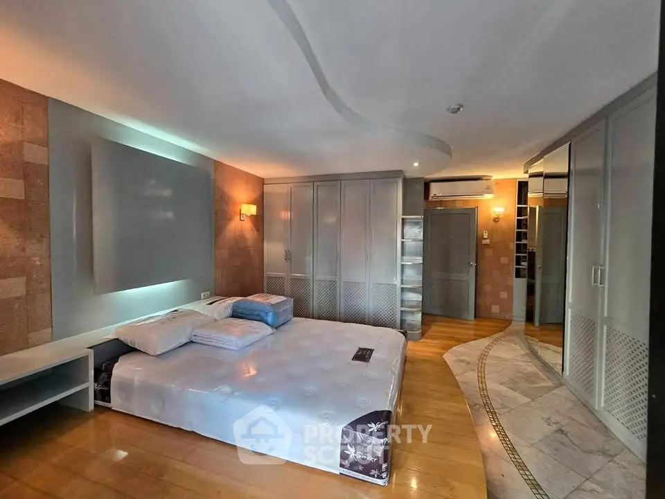 Spacious bedroom with modern design and ample storage space
