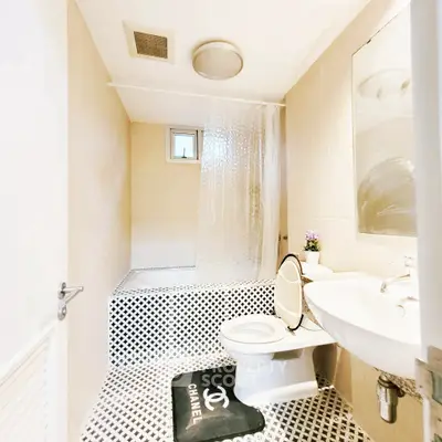 Modern bathroom with stylish decor and unique flooring design