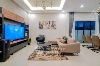 Luxurious modern living room with elegant decor and spacious seating area.