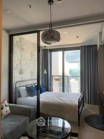 Modern bedroom with glass partition and city view balcony in luxury apartment